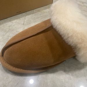 UGG Scuffette II size 7 women. Never worn, new in box. Traditional tan color.